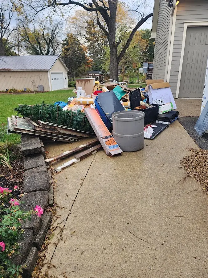 Dumpster being loaded with debris for 3 Yard Dumpster Rental in Norfolk